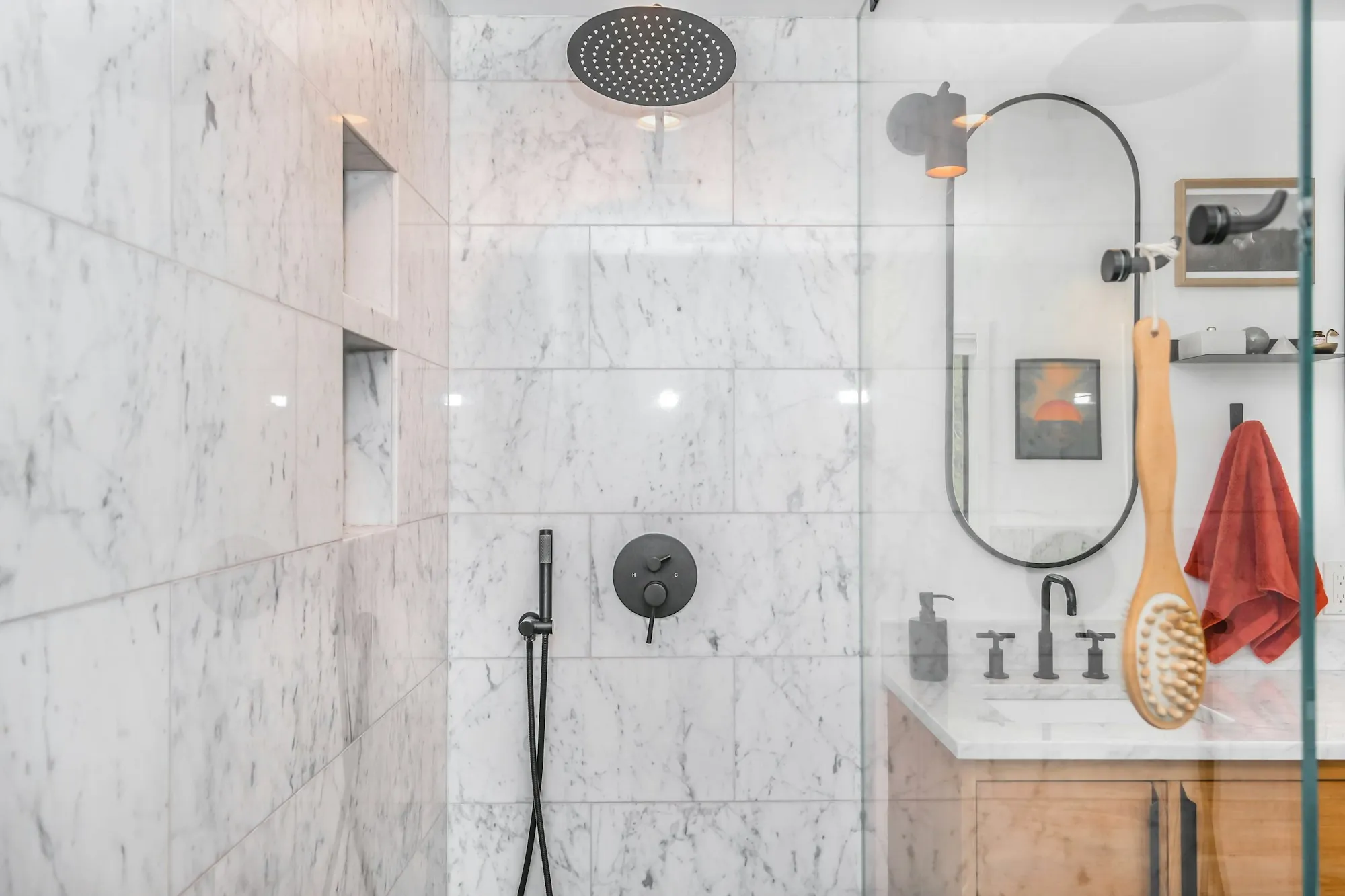 Salt-Free Water Conditioners in Newport Beach Marble-tiled shower with a black shower head